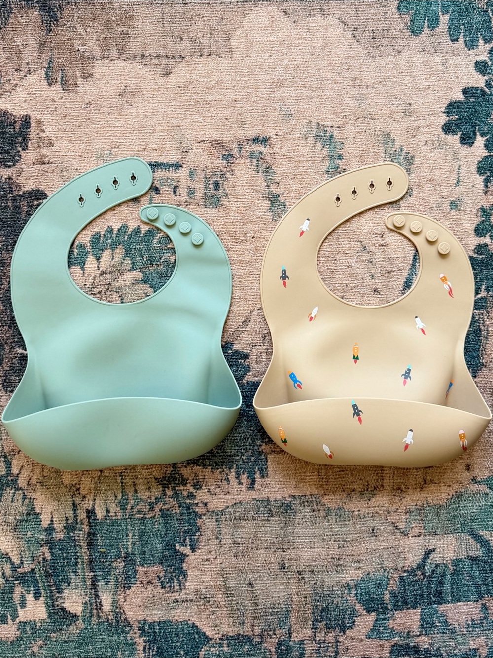 Bundle of Two Mushie Baby Silicone Bibs in Beige Rocketship & Sage Green
